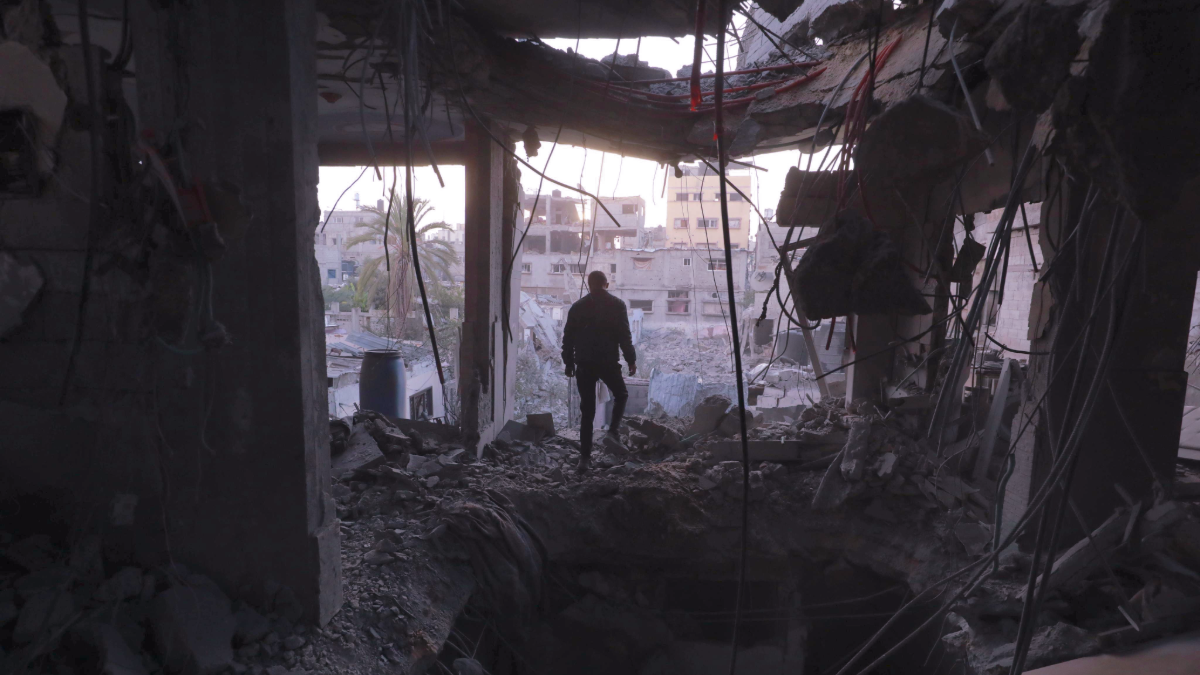 A man surveys the rubble in the al-Bureij camp in Gaza