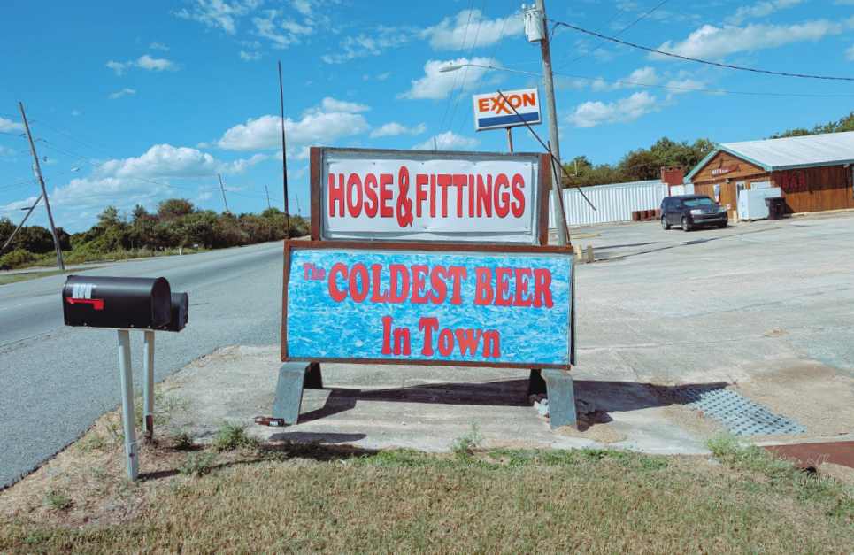 The road to Venice, Louisiana, with April's bar in the background (Dispatch)